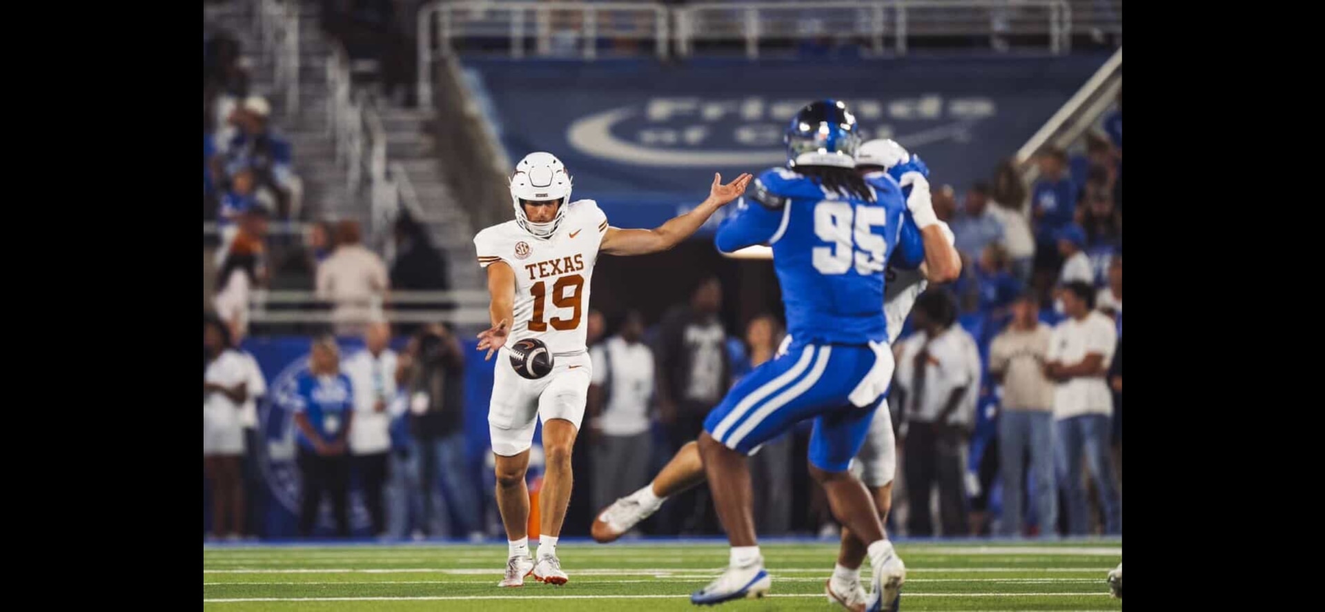 American footballers in blue and white uniforms.