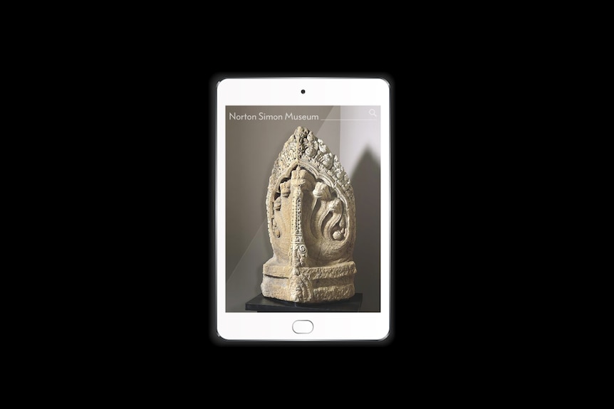 A white tablet shows photo of a five headed serpent sandstone sculpture on plinth display.