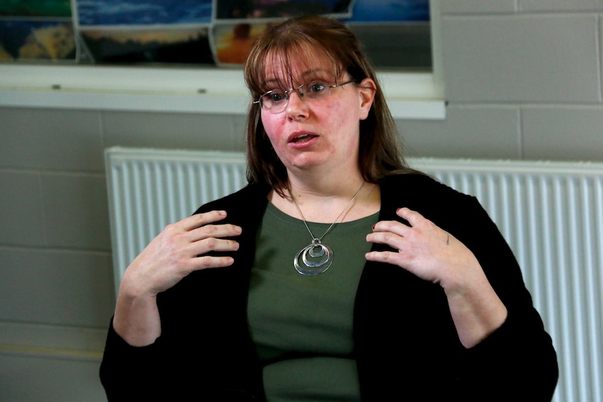 A woman uses her hands while talking to express her emotions.