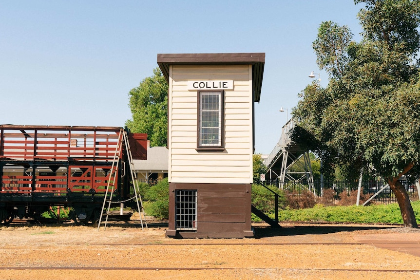 A wooden tower with the name "Collie" on a sign on the top.