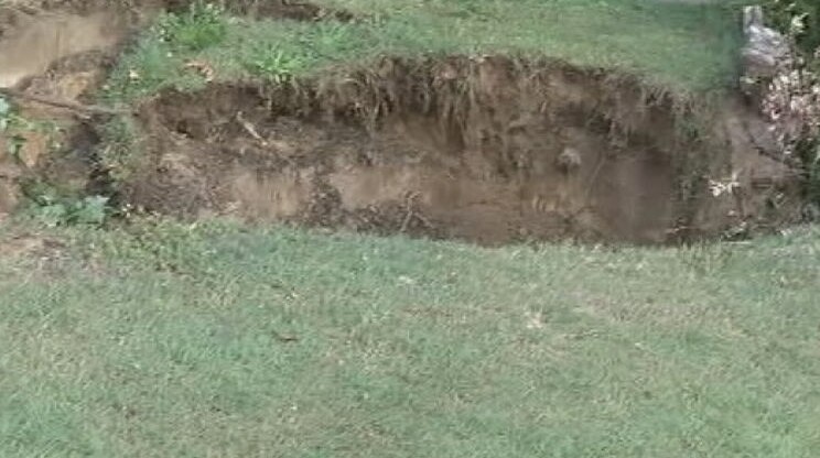 A sink hole that opened up in the front yard of a Swansea property.