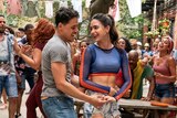 Anthony Ramos and Melissa Barrera, a young Latinx couple dancing in the street, In The Heights 