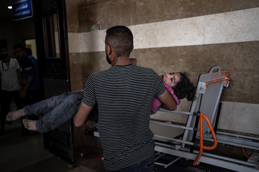 A Palestinian wounded in Israeli bombardment of the Gaza Strip is brought to a hospital.