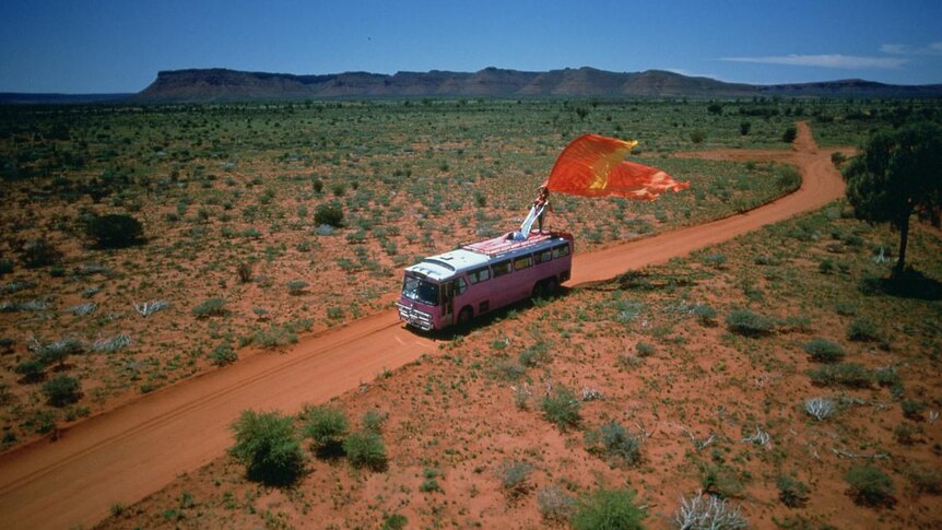 pink bus on outback road