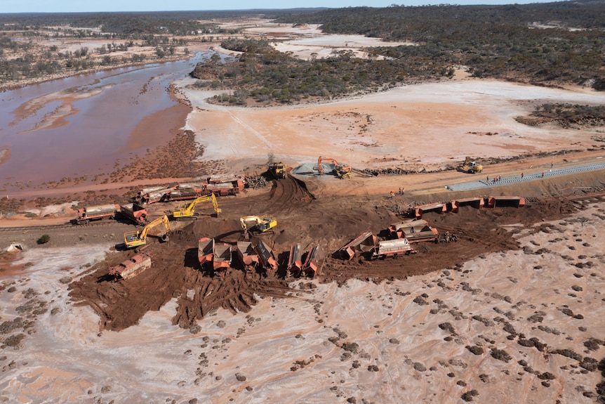 An aerial view of the massive clean-up operation at the site of a remote train derailment.   