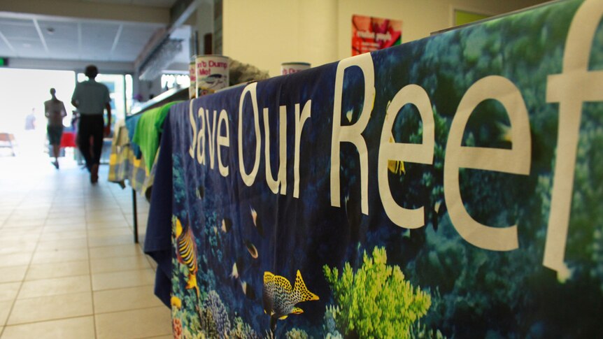 Sign that says 'save the reef'