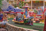 A wide view of the tiny characters and model trains.