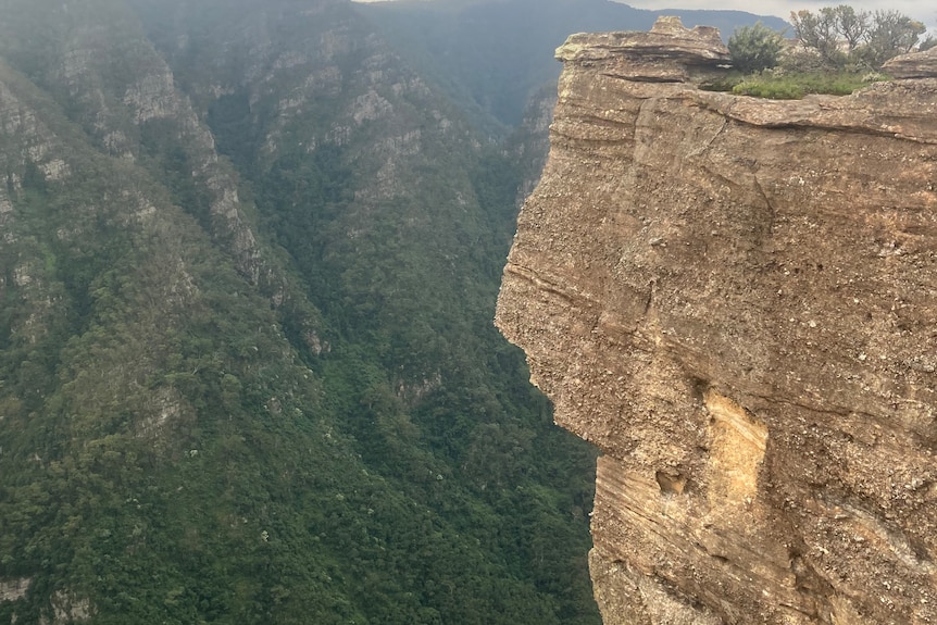 A high clifftop and mountainous range 