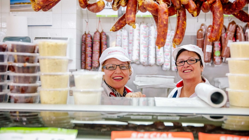 Deli staff behind the counter