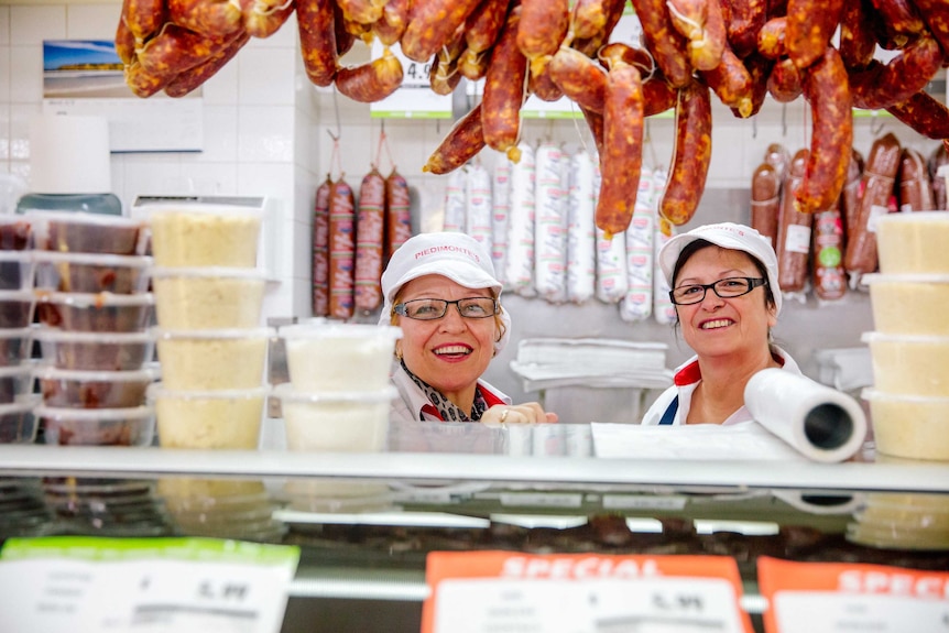 Deli staff behind the counter