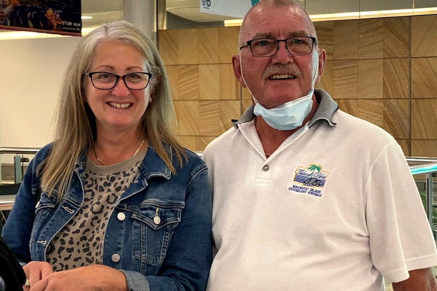 Roger and Glenda Haynes with their bags at Sydney airport after arriving from New Zealand.