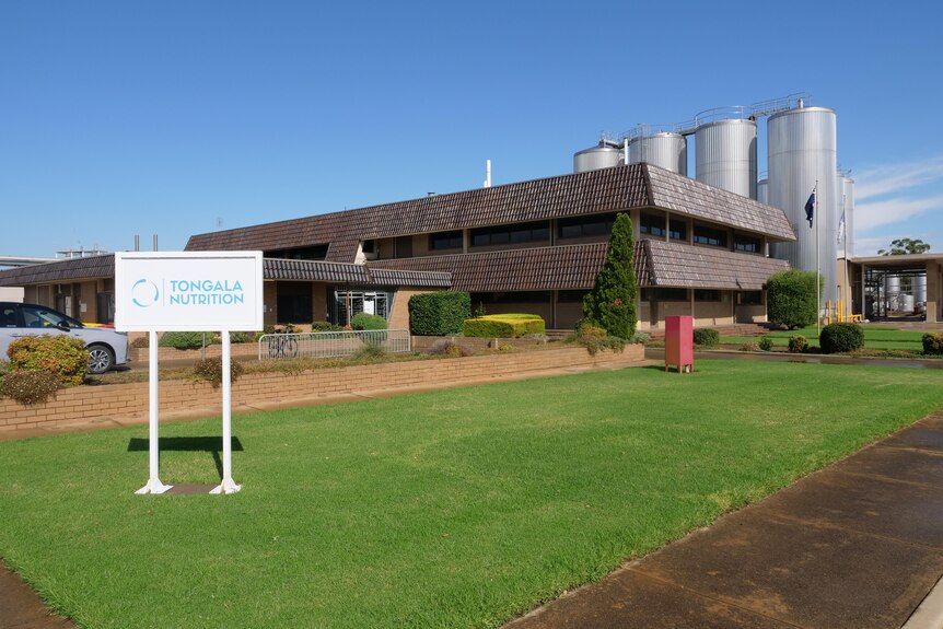 A dairy factory viewed form the ground with a  sign to the left saying 'Tongala Nutrition' 
