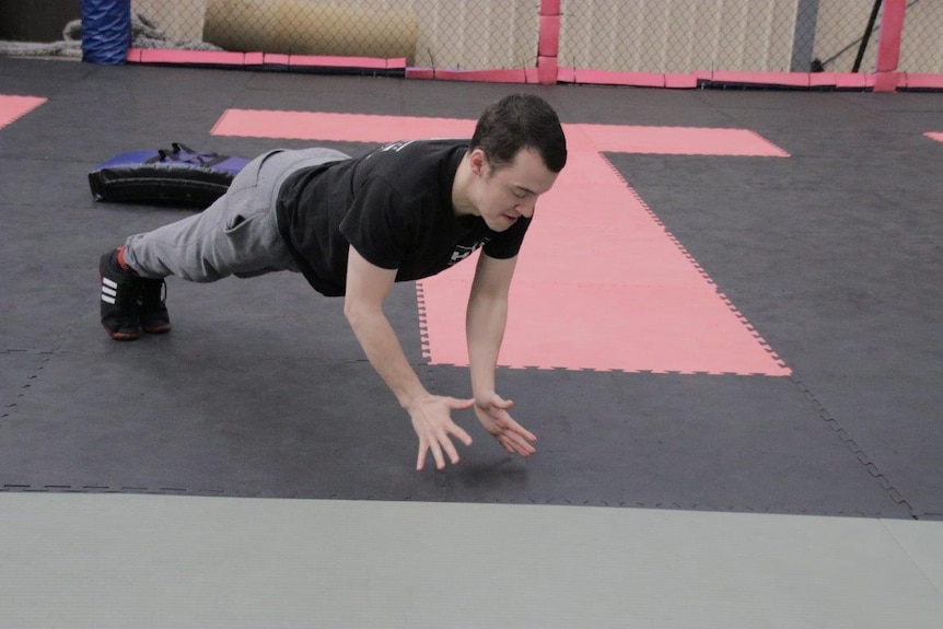 Mixed martial arts fighter doing a push up