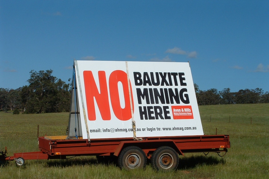 Signs display community opposition to proposed bauxite mine