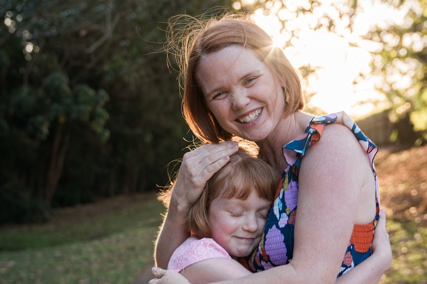 Parenting expert Kaylene Henderson hugging her daughter