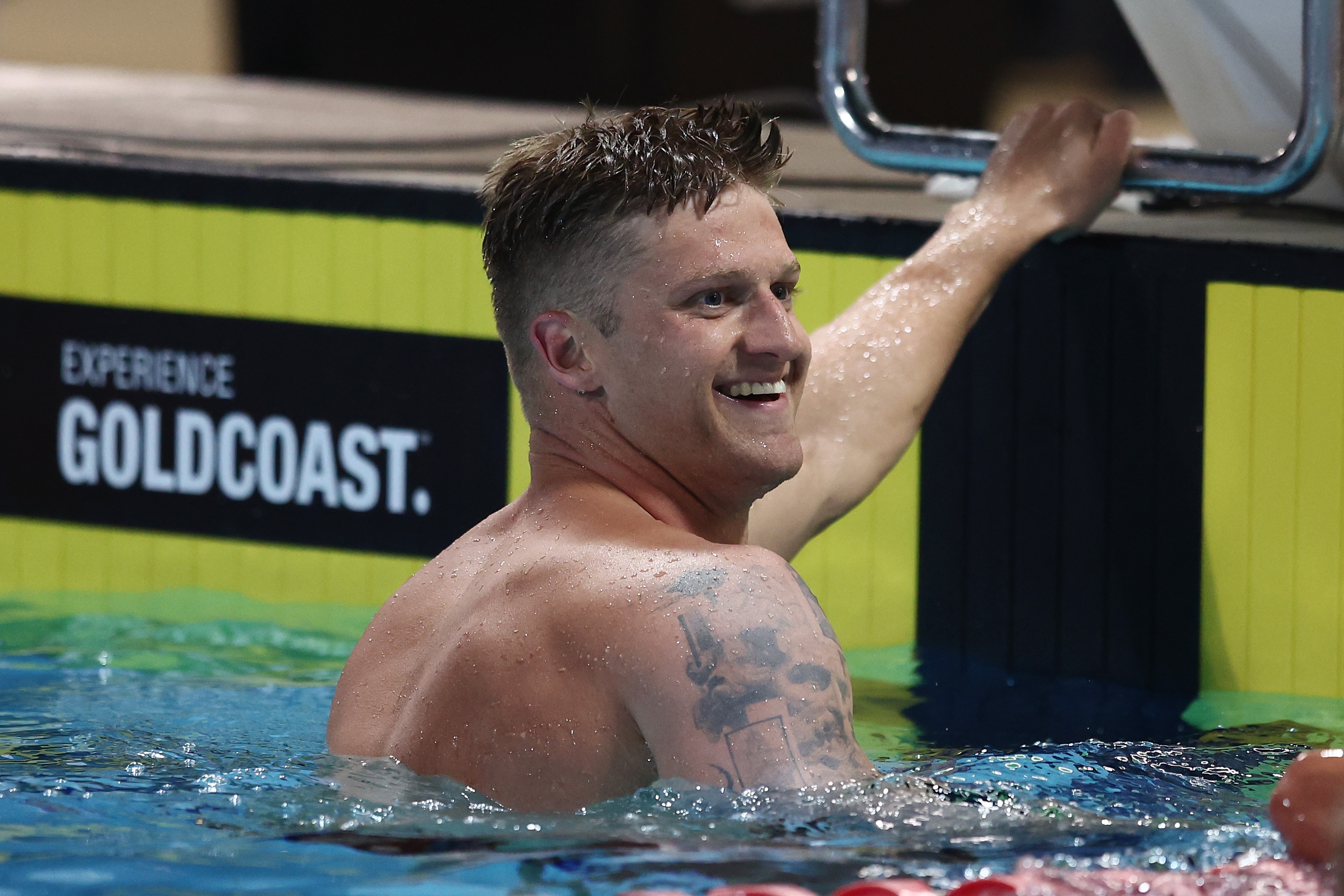 Samuel Williamson smiles on the wall