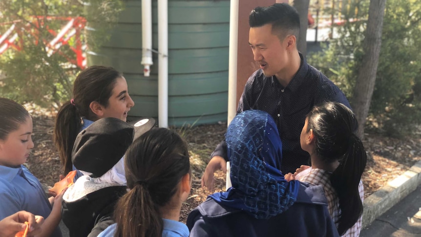 Teacher Daniel Yong doing a lunchtime yarning circle with students