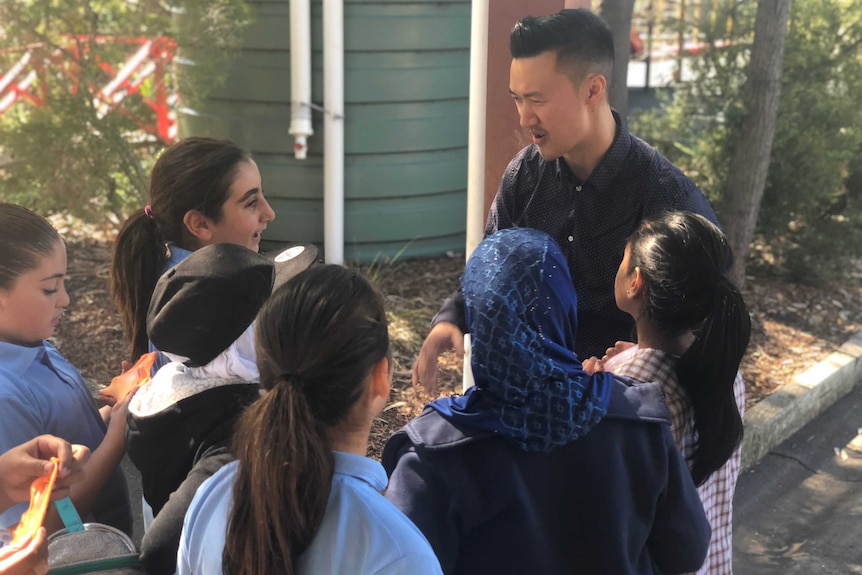 Teacher Daniel Yong doing a lunchtime yarning circle with students