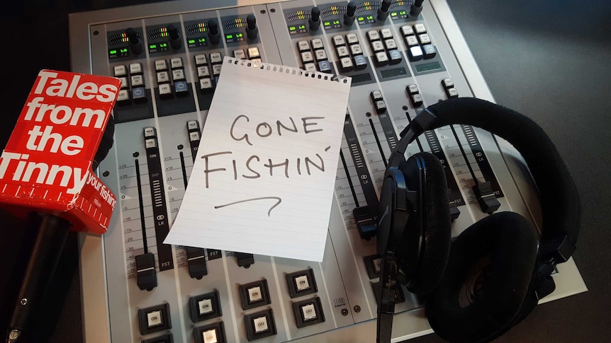 A Gone Fishin sign on a radio desk