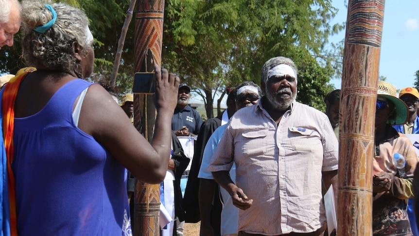 A Baniyala traditional owner with his face painted addresses the community in Arnhem Land.