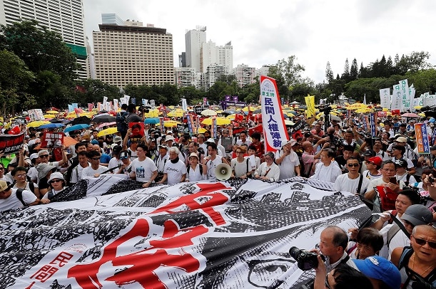 Demonstrators attend a protest to demand authorities scrap a proposed extradition bill with China.