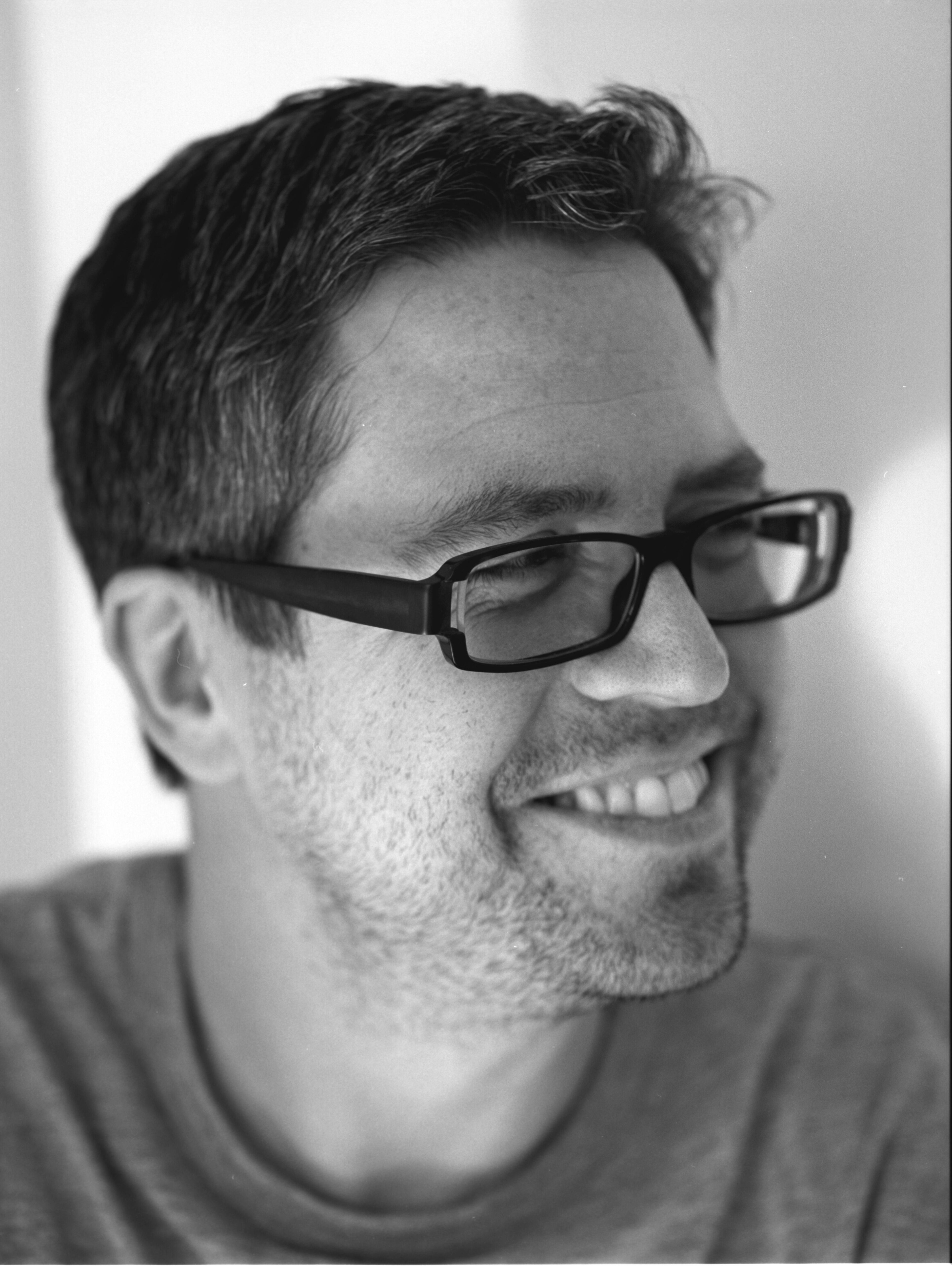 Headshot of a man in glasses