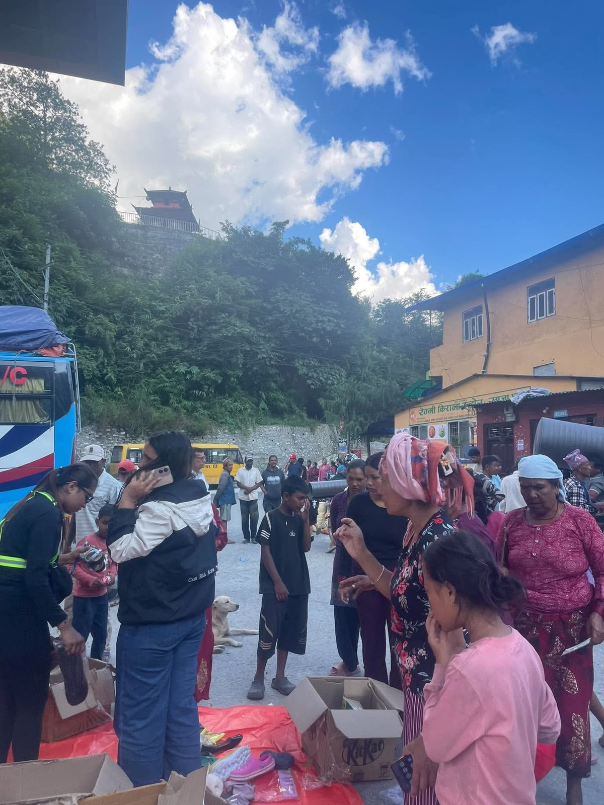 A crowd of residents in a temporary camp.