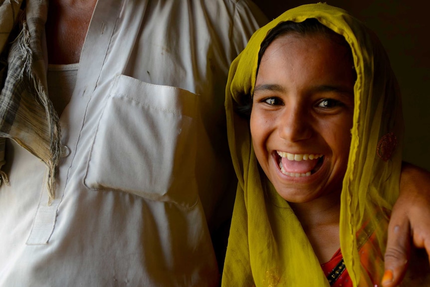 A girl laughs in rural Afghanistan