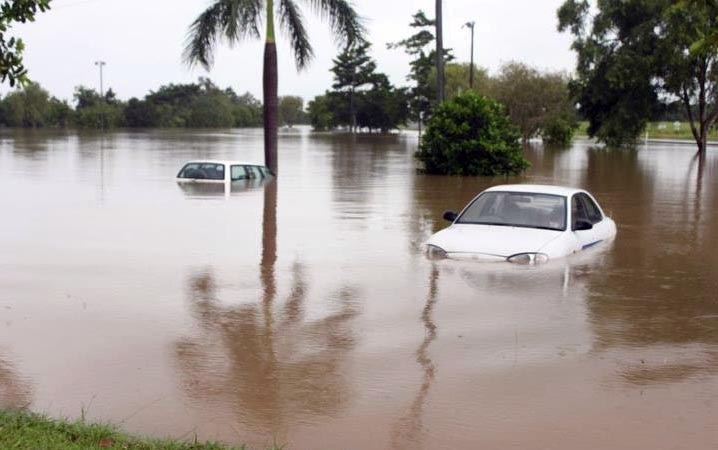 Cars submerged by floodwaters in Cairns.