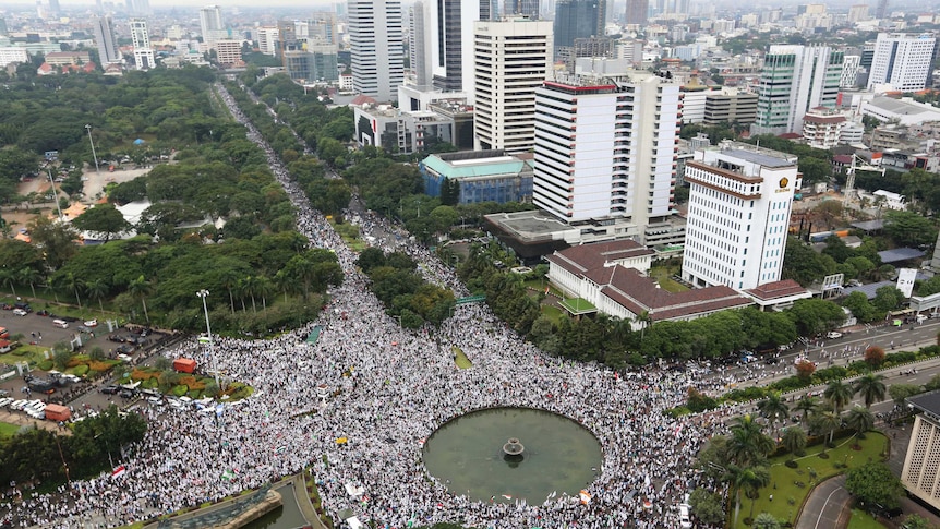 A large crowd of at least 150,000 gathers in Indonesia's capital city of Jakarta