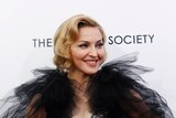 Madonna poses for photos at the premiere of WE