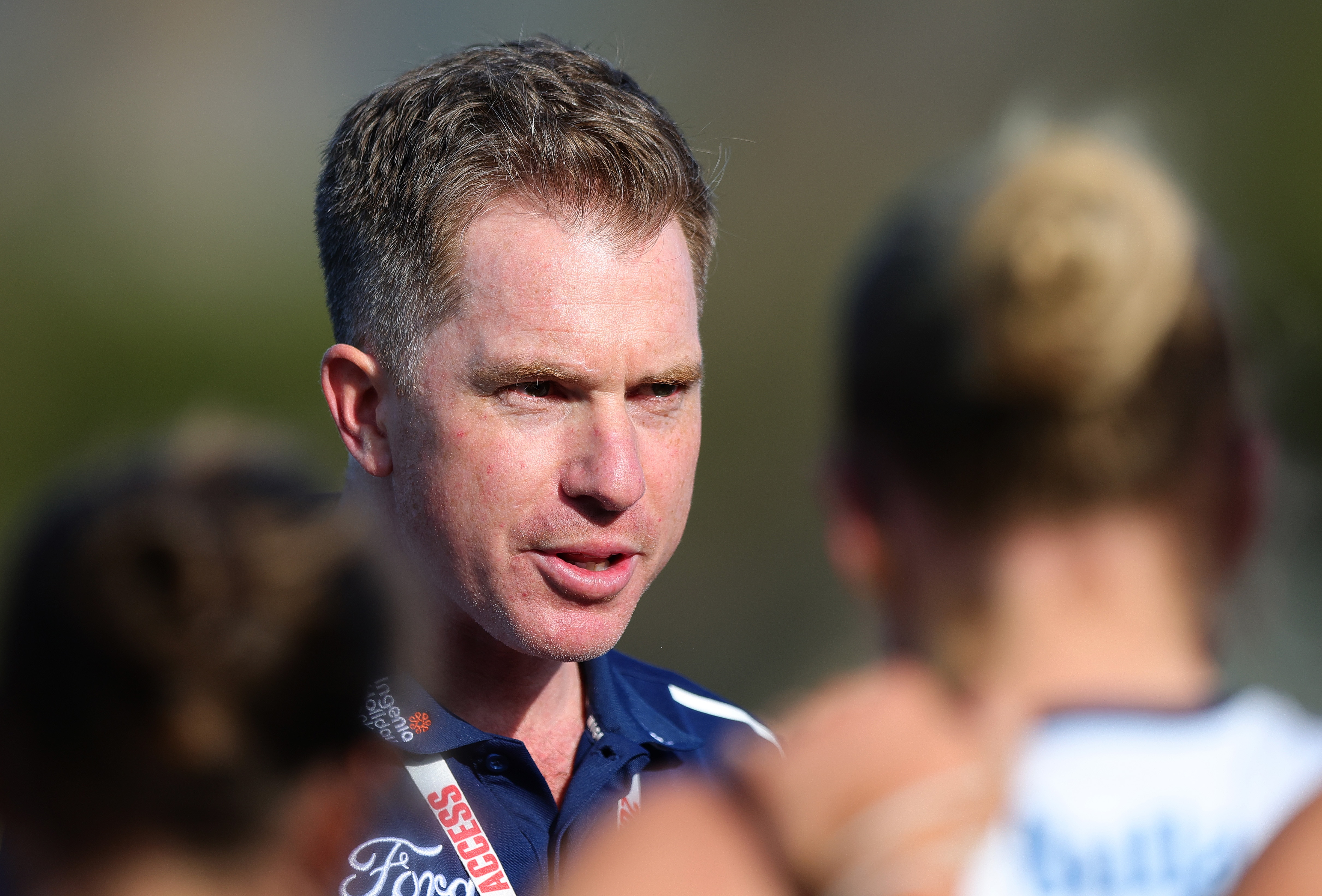 Mick Stinear speaks to his team