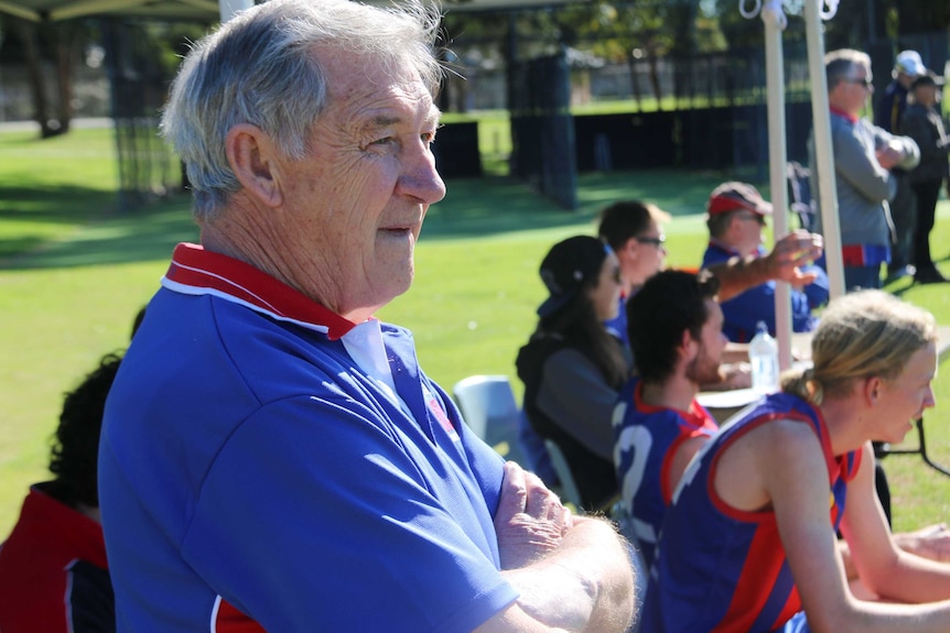 Kevin Paltridge looks out on a football field.