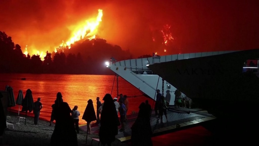Mass evacuations on the island of Evia in Greece as fires rage