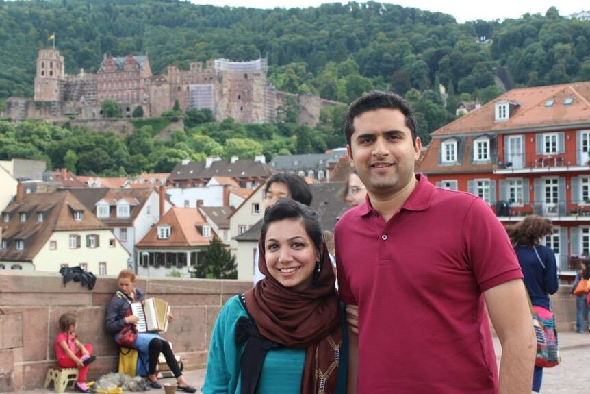 Bushra Zainuddin and her husband Zain Zafar pose for a photo.