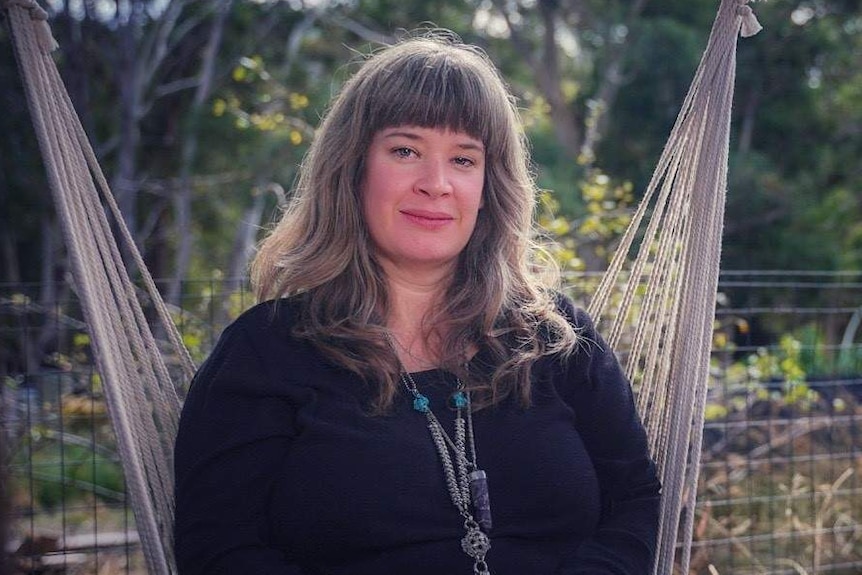 Kate the life long renter sitting on a hammock, Tasmania, May 2019