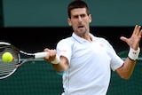 Novak Djokovic plays a forehand during his first round win at Wimbledon.