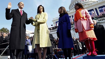 Barack Obama taking the Oath of Office as his wife Michelle and daughters look on