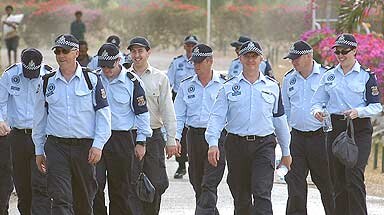 The first contingent of Australian Federal Police at the start of their law-and-order mission in PNG.