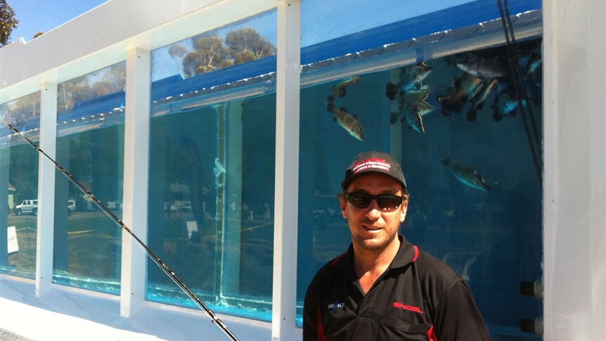 Guy Woods in front of the mobile aquarium