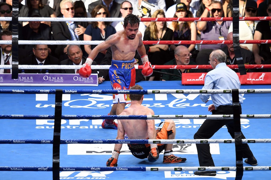 Jeff Horn (bottom) falls to the ground against Manny Pacquiao.