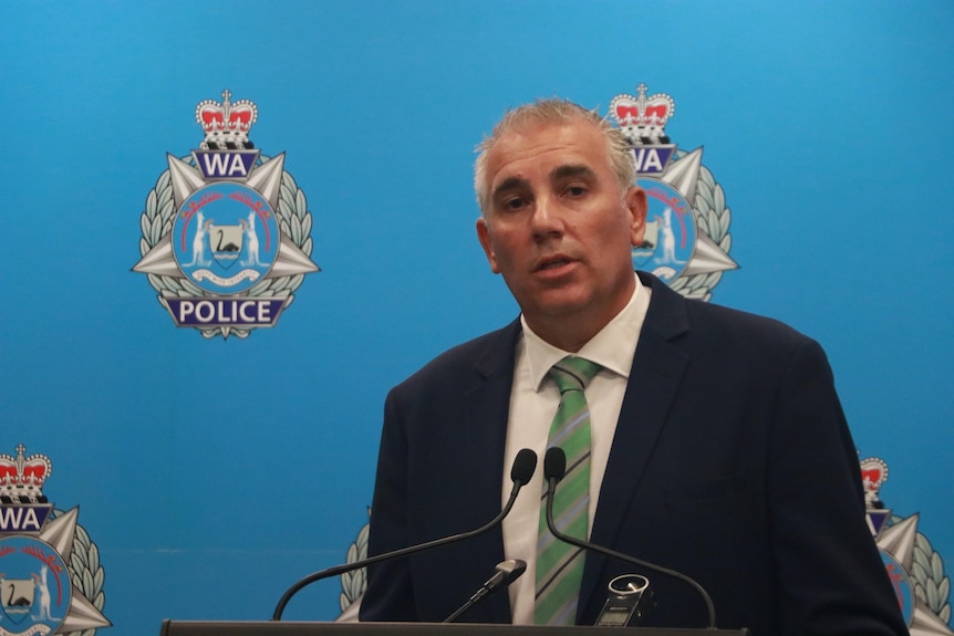 Detective Inspector Quentin Flatman at a lectern at WA police headquarters