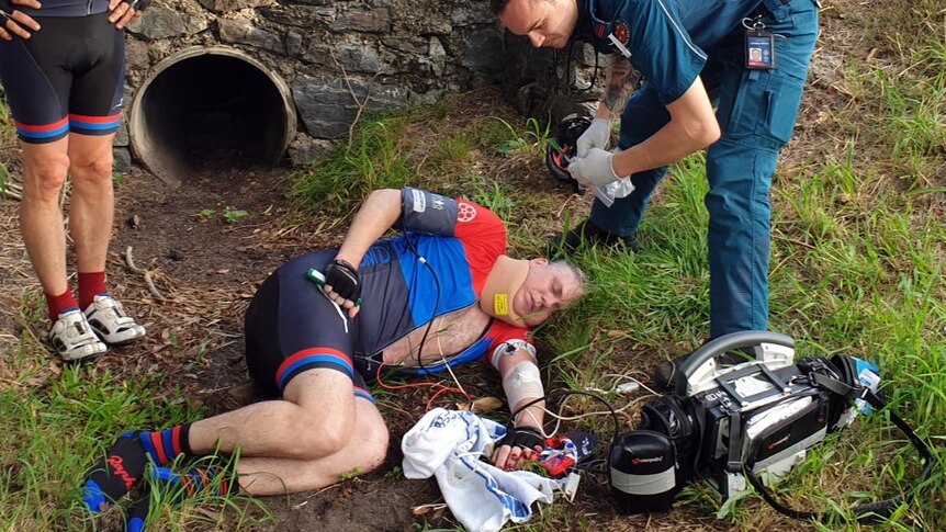 Mark Berridge lies in agony, while a paramedic assesses what turns out to be life changing injuries.