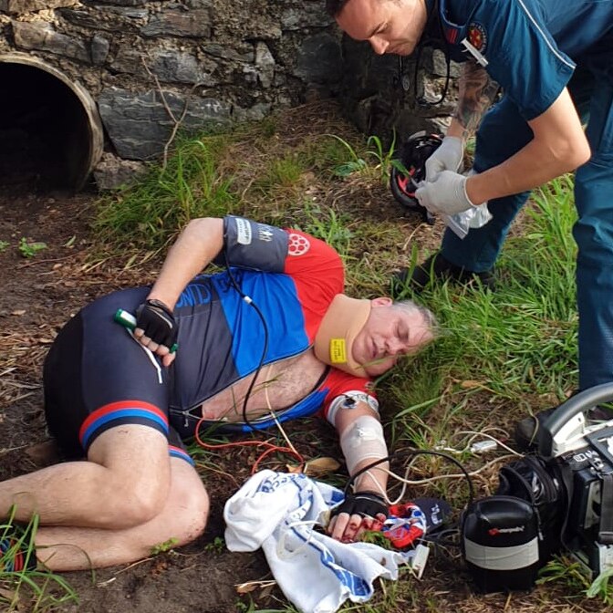 Mark Berridge lies in agony, while a paramedic assesses what turns out to be life changing injuries.