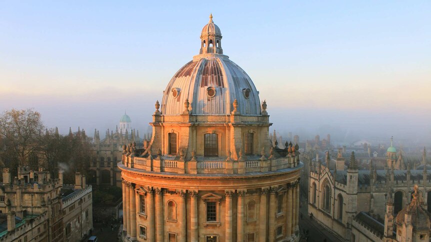 At sunset, you look down at a grand neoclassical dome surrounded by similar buildings at Oxford University.