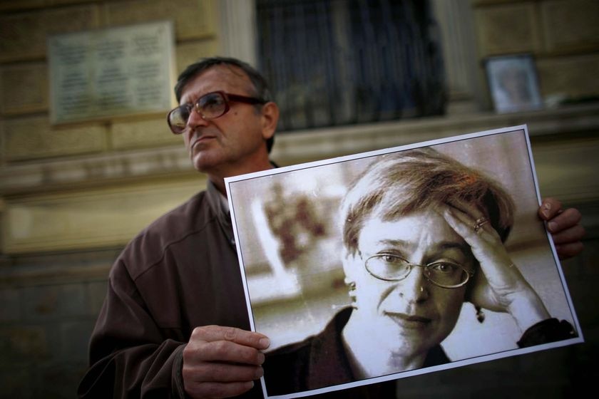 A protester holds a picture of murdered Russian journalist Anna Politkovskaya