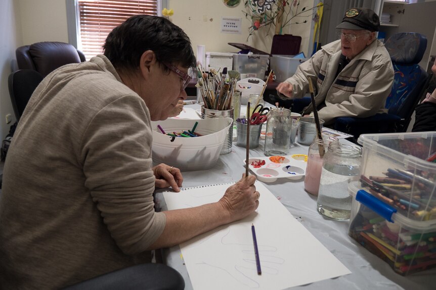Jenny Clarke (left) and Chris Roads (right) begin work on their creations.