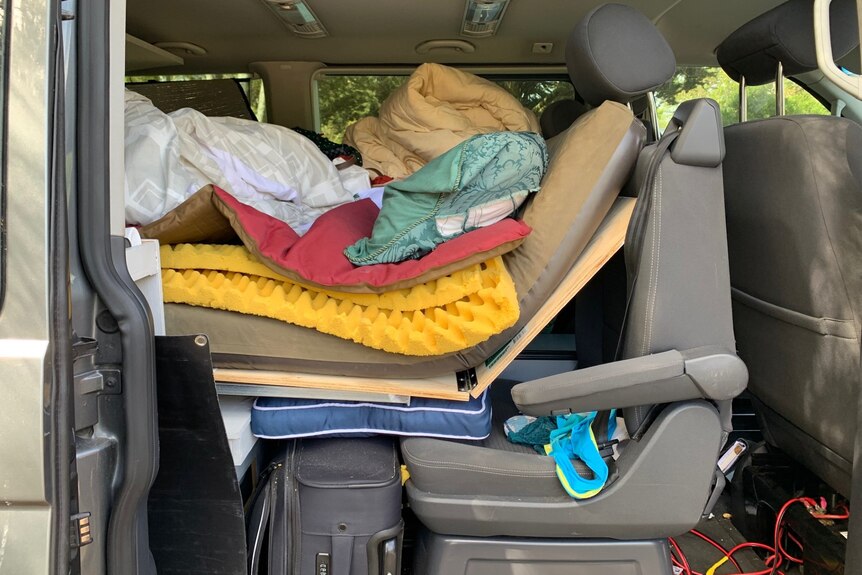 van packed with matress and personal items