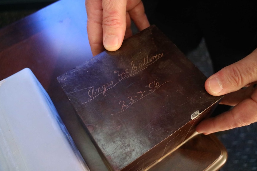 Angus McCallum's cremated remains in a small wooden box.