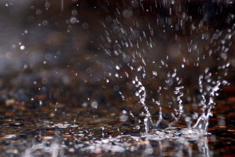 A raindrop explodes on the ground during welcome rain in Brisbane, June 6, 2007.